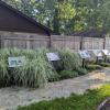 StoryWalk boards and garden on stone walking path