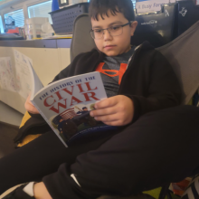 Student reading book. 
