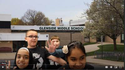 Photo of kids in front of the school
