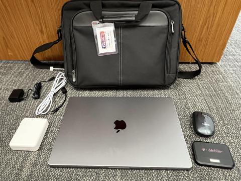 Mac laptop kit including a laptop, carrying case, charger, mouse, and mobile hotspot