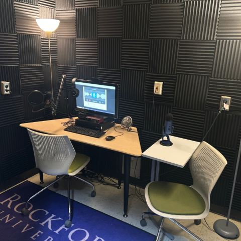 Recording studio with computer and recording equipment. 