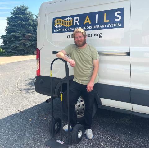 Tele Kansai stands next to a RAILS van with a dolly 
