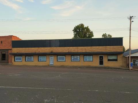New branch building with 'Coming Soon!' and 'North Pike District Library Perry Branch' on signs in the windows