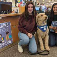VHHS therapy dog Basil comes to read with students.
